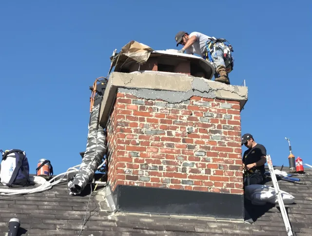 Garfield Heights Chimney Sweep installing a custom chimney crown in Garfield Heights, OH