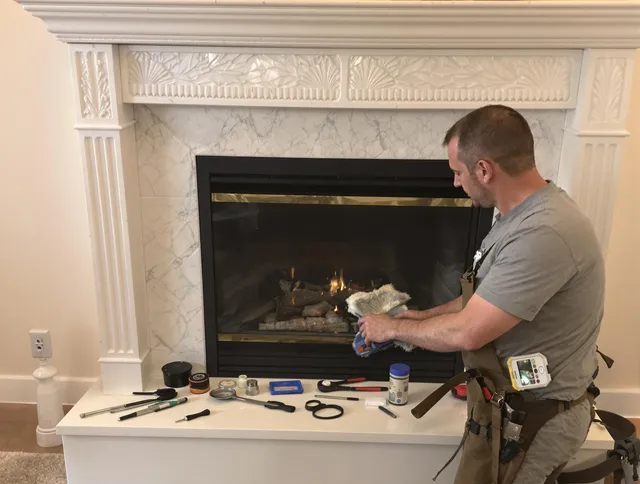 Garfield Heights Chimney Sweep performing fireplace maintenance in Garfield Heights, OH
